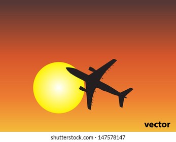 Vector concept or conceptual black plane,airplane aircraft silhouette flying over sky at sunset,sunrise background,metaphor to air,travel,transportation,jet,flight,transport,business,vacation,tourism