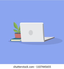 Vector concept illustration of office workplace. Laptop, potted plant and book lying on the surface.Isolated objects on violet background