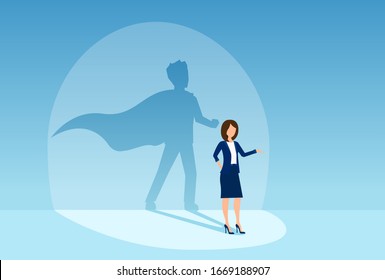 Vector of a confident business woman with a super businessman shadow 