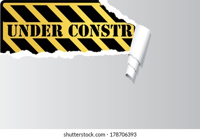 Vector construction sign under ripped paper.