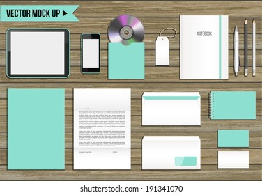 Vector corporate identity mock up. Consist of tablet pc, smart phone, CD envelope, tag, notebook, folder, paper A4, letter, business cards, spiral notepad, pen, pencil.