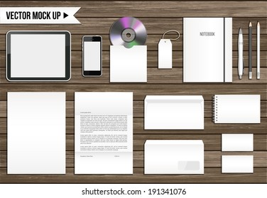 Vector corporate identity mock up. Consist of tablet pc, smart phone, CD envelope, tag, notebook, folder, paper A4, letter, business cards, spiral notepad, pen, pencil.