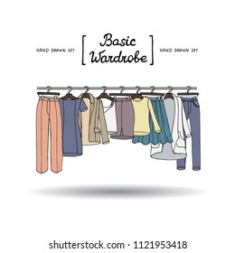 Vector cover with hand drawn colored basic wardrobe. Illustration on the theme of fashion
