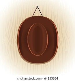 Vector cowboy hat on the wood background.