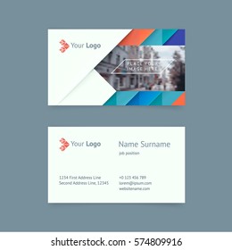 Vector creative business card template with blue and coral triangles, strip for business, technology. Simple and clean design with a logo and a place for a photo. Creative layout corporate identity.