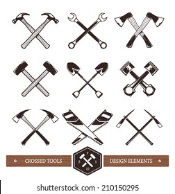 Vector crossed hard work tools. Set of useful elements for emblems, badges or any other retro designs. 