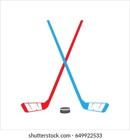 Vector crossed hockey red and blue sticks and puck icon set isolated on white backgound. vector hockey label or emblem