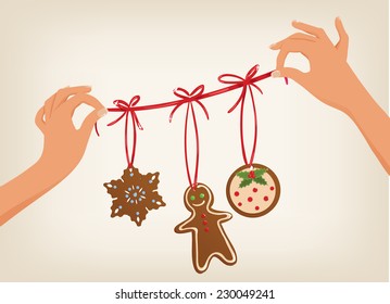 Vector cute hands holding a Christmas garland with gingerbread cookies