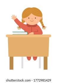 Vector cute happy schoolgirl sitting at the desk with hand up. Elementary school classroom illustration. Clever kid in glasses at the lesson. Girl ready to answer teacher’s question
