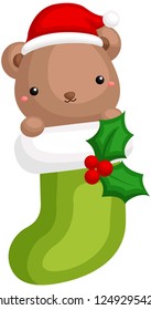 Un vector de adorable oso escondido dentro de una cuchara de Navidad