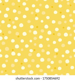 Vector cute medium snow polka dot seamless pattern on yellow background. 