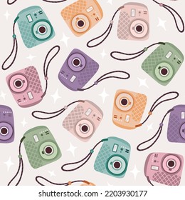 Vector cute seamless pattern with colored instant cameras
