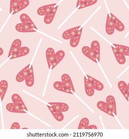 Vector cute seamless pattern with heart lollipop.