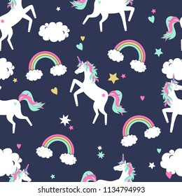 Vector cute seamless pattern with unicorns, rainbows and clouds