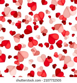 Vector Valentine’s Day seamless pattern with small red and pink hearts on a white background.