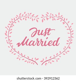Vector decorative hand drawn lettering of text Just Married and pink wreath isolated on white background