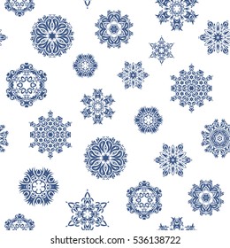 Vector design. Christmas Stylized blue Snowflakes on a White Background. Seamless Repeating Pattern.