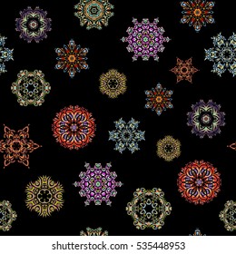 Vector design. Christmas Stylized green, blue and neutral Snowflakes on a Black Background. Seamless Repeating Pattern.