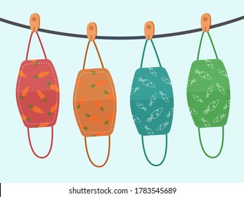 Vector design. The colorful carrot pattern cloth face mask is hanging for sunlight get dried after used and washed. Reuse after cleanness for protect virus. 