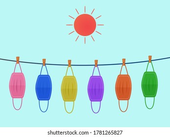 Vector design. The colorful cloth face mask is hanging for sunlight get dried after used and washed. Reuse after cleanness for protect virus. 