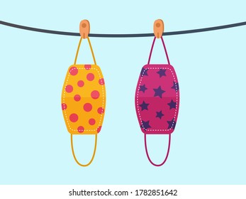 Vector design. The colorful cloth face mask is hanging for sunlight get dried after used and washed. Reuse after cleanness for protect virus. 