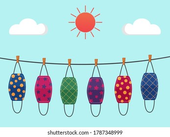 Vector design. The colorful cloth face mask is hanging for sunlight get dried after used and washed. Reuse after cleanness for protect virus. 