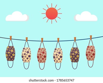 Vector design. The colorful flowers pattern cloth face mask is hanging for sunlight get dried after used and washed. Reuse after cleanness for protect virus. 