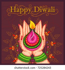 Vector design of hand of Indian lady holding diya for Diwali on colorful art style background of India