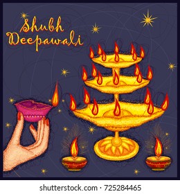 Vector design of hand of Indian lady holding diya for Diwali on colorful art style background of India