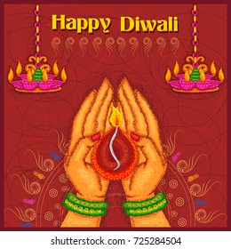 Vector design of hand of Indian lady holding diya for Diwali on colorful art style background of India