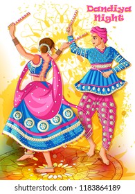 Vector design of Indian couple playing Garba in Dandiya Night Navratri Dussehra festival of India