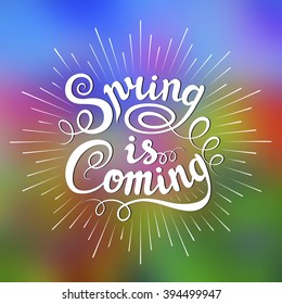 Vector design. Spring is Coming. Hand-drawn lettering on blurred background. Light rays of burst.