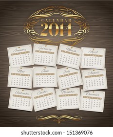 Vector design template - Calendar of 2014 with golden ornate elements on a wooden background