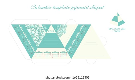 Vector desktop pyramid calendar template for 2022. Decoration for your home, business. Corporate and business calendar. Calendar with mandala 2022 in a minimalist style. The week starts on Sunday