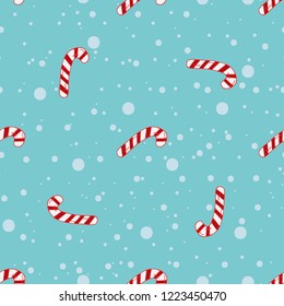 Vector doodle seamless pattern with cute caramel candy on blue background with cartoon snowflakes. Christmas festive doodle illustration.