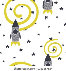 Vector doodle style hand drawn rockets and stars in space seamless pattern. Scandinavian kids style. 
