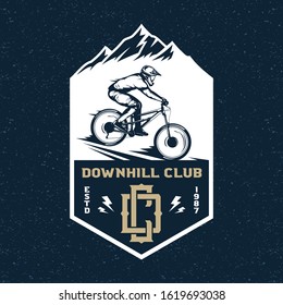 Vector downhill mountain biking badge, logo, label with rider on a bike and mountain silhouette. Downhill, enduro, cross-country biking illustration