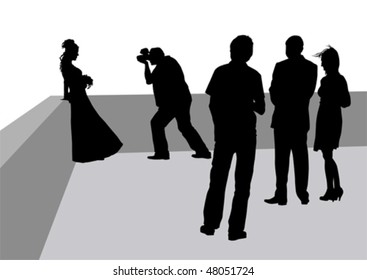 Vector drawing of photographers at a wedding. Silhouettes on a white background