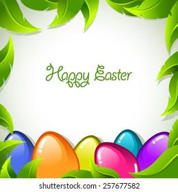 Vector Easter background with colorful eggs and green leaves