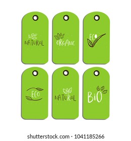 Vector eco badge or tag, bio green logo. Vegan sign for cafe, restaurants, products packaging. Hand drawn leaves, branches, plant elements with lettering. Organic design template.