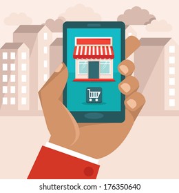 Vector e-commerce concept in flat style - hand holding mobile phone with shop icon on it