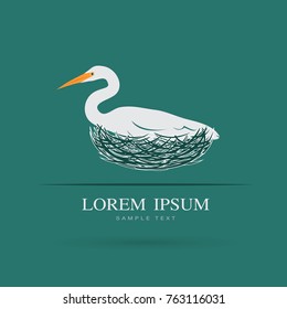 Vector of Egret bird is feeding its eggs in the nest on blue background. Bird Logo. Animal.