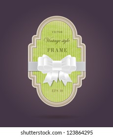 Vector elegant hand made colored paper textured retro label with silky ribbon bow knot