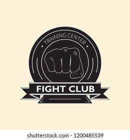 Vector emblem of the fight club with the image of two fists and knights shield. The logo designates the training center for combat training.