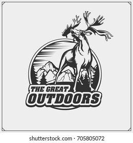 Vector emblem with mountains and beautiful deer.