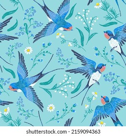 Vector embroidery seamless pattern with blue forget-me-not flowers, chamomile, lily of the valley and  swallows  on a blue background.