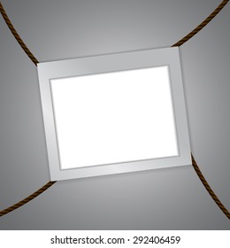 Vector : Empty frame and clothespin on rope