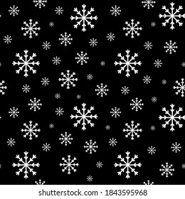 Vector endless pattern: snowflakes on a black background. Snow seamless background.