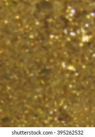 Vector EPS10 gold metal effect with blurred glowing particles. Abstract background with iridescent mesh gradient. Visual illusion of sparcles metal surface. Background for Christmas or party themes