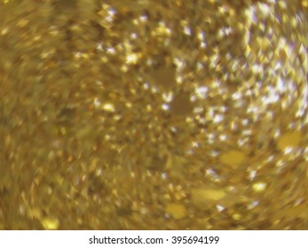 Vector EPS10 gold metal effect with blurred glowing particles. Abstract background with iridescent mesh gradient. Visual illusion of sparkles metal surface. Background for Christmas or party themes
